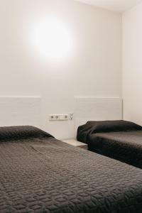 Postel nebo postele na pokoji v ubytování Hauzify I Apartament Arroyo