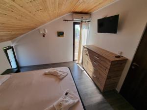 Ένα ή περισσότερα κρεβάτια σε δωμάτιο στο CASA MOREANA