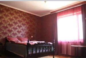 A bed or beds in a room at GIO-NIKA