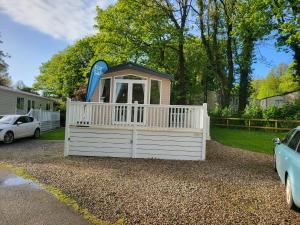 a play house with a slide in a yard at Remarkable 3-Bed lodge in St Minver in Saint Minver