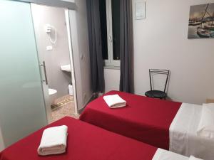 Postel nebo postele na pokoji v ubytování Nautilus Hotel