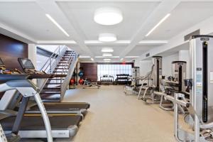 a gym with treadmills and elliptical machines in a room at E Village 1br w gym wd doorman nr Union Sq NYC-278 in New York