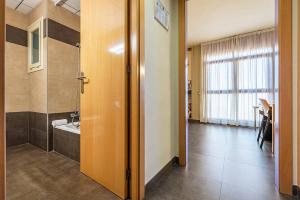 a room with a bathroom with a sink and a shower at Hotel Pere III El Gran in Vilafranca del Penedès