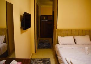 Letto o letti in una camera di King Badr pyramids