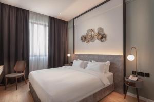 Postel nebo postele na pokoji v ubytování FUHOTEL