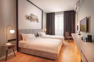 Postel nebo postele na pokoji v ubytování FUHOTEL