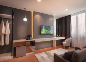 TV a/nebo společenská místnost v ubytování FUHOTEL