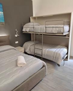 Postel nebo postele na pokoji v ubytování Costa degli Dei Rooms