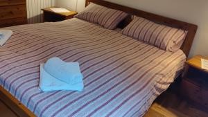 A bed or beds in a room at La Casetta nelle Dolomiti