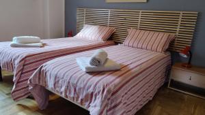 A bed or beds in a room at La Casetta nelle Dolomiti