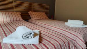 A bed or beds in a room at La Casetta nelle Dolomiti