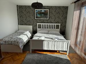 Una cama o camas en una habitación de Guest House Aurora