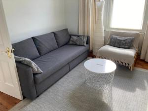 a living room with a couch and a coffee table at The Blue House in Worthing
