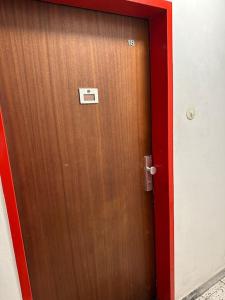 a wooden door with a sign on it at Apartment4 you in Vienna