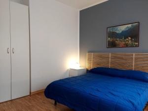 A bed or beds in a room at La Casetta nelle Dolomiti