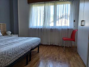 A bed or beds in a room at La Casetta nelle Dolomiti