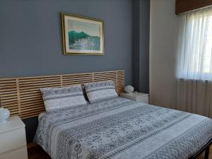 A bed or beds in a room at La Casetta nelle Dolomiti