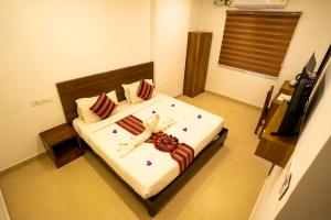 Voodi või voodid majutusasutuse Trivers Resort Munnar toas