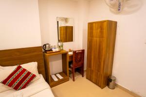 Voodi või voodid majutusasutuse Trivers Resort Munnar toas