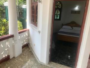 Letto o letti in una camera di Kingz and Queenz - Negombo