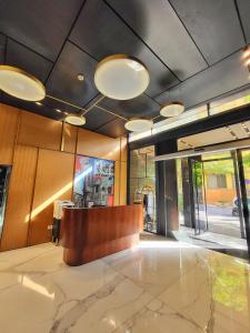 a lobby with a reception desk in a building at Monot Suites in Beirut