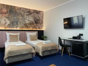 Posteľ alebo postele v izbe v ubytovaní Garbarska 22 Aparthotel
