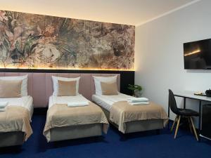 Posteľ alebo postele v izbe v ubytovaní Garbarska 22 Aparthotel