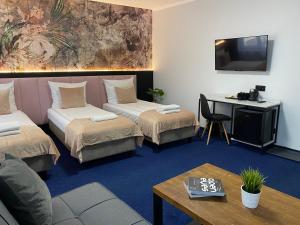 Posteľ alebo postele v izbe v ubytovaní Garbarska 22 Aparthotel
