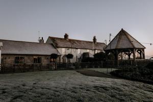 a building with a gazebo in front of it at The Harty Estate in Eastchurch