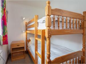Un pat sau paturi într-o cameră la New Cottage