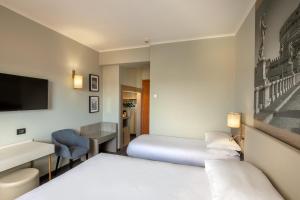 Postelja oz. postelje v sobi nastanitve Hotel Marc'Aurelio