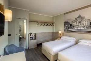 Postelja oz. postelje v sobi nastanitve Hotel Marc'Aurelio