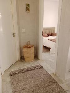 Postel nebo postele na pokoji v ubytování Le cocon de Mariem à El Kantaoui