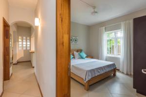 Ένα ή περισσότερα κρεβάτια σε δωμάτιο στο Kisana Residence - Lovely 2 Bedroom Apartment - Pointe aux Canonniers +34 φωτογραφίες
