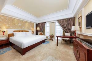 Postel nebo postele na pokoji v ubytování WYNDHAM Foshan shunde