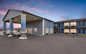 a building with a parking lot in front of it at Days Inn by Wyndham Carlisle in Carlisle