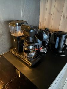 a coffee maker sitting on top of a counter at Stor moderne leilighet i Henningsvær, 70 kvm in Henningsvær