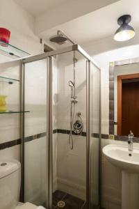 a bathroom with a shower and a toilet and a sink at Neta's Central Gem with Bomb Shelter in Tel Aviv in Tel Aviv