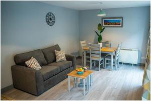 a living room with a couch and a table at Chapel Place, Town Centre in Killarney
