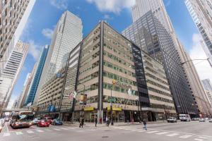 a tall building on a city street with cars at La Quinta by Wyndham Chicago Downtown in Chicago