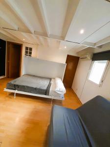 a bedroom with a bed in the middle of a room at Piso para 4 - Puerta del Sol in Madrid