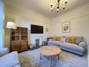 a living room with a couch and a table at Ellergill in Keswick