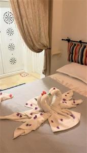 Postel nebo postele na pokoji v ubytování Hôtel Djerba Authentique - Au centre de Midoun