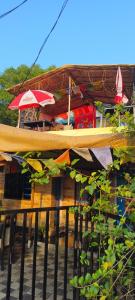 a surfboard is on top of a building at Peace and love stay in Alleppey
