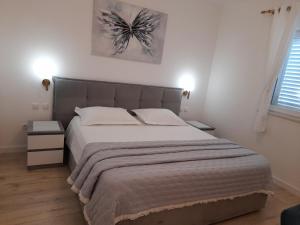 Posteľ alebo postele v izbe v ubytovaní Apartments Proto