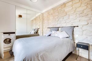 Postel nebo postele na pokoji v ubytování Volontaire