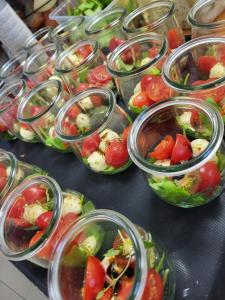 a bunch of salad dishes in plastic containers on a table at Gästehaus Kiebel in Lösnich