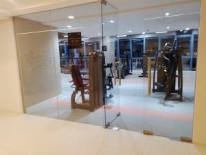 a glass window in a room with a gym at 38 Park Avenue condominium, IT Park in Cebu City
