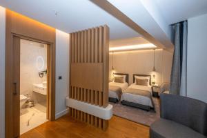Postel nebo postele na pokoji v ubytování Baver Hotel