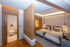 Postel nebo postele na pokoji v ubytování Baver Hotel